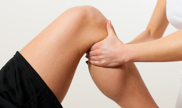 Patient at the physiotherapy doing physical therapy exercises with his therapist